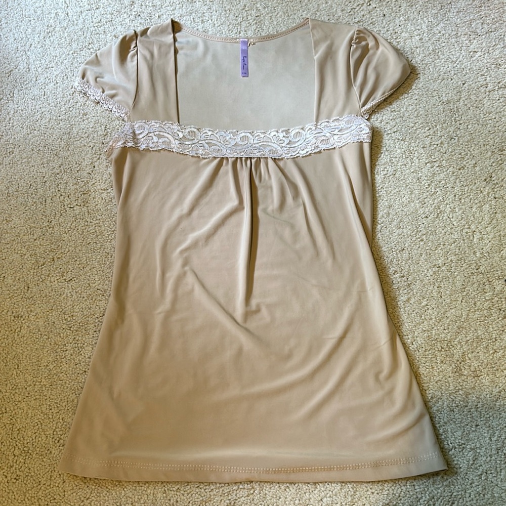 Beige flowy top with white lace detailing